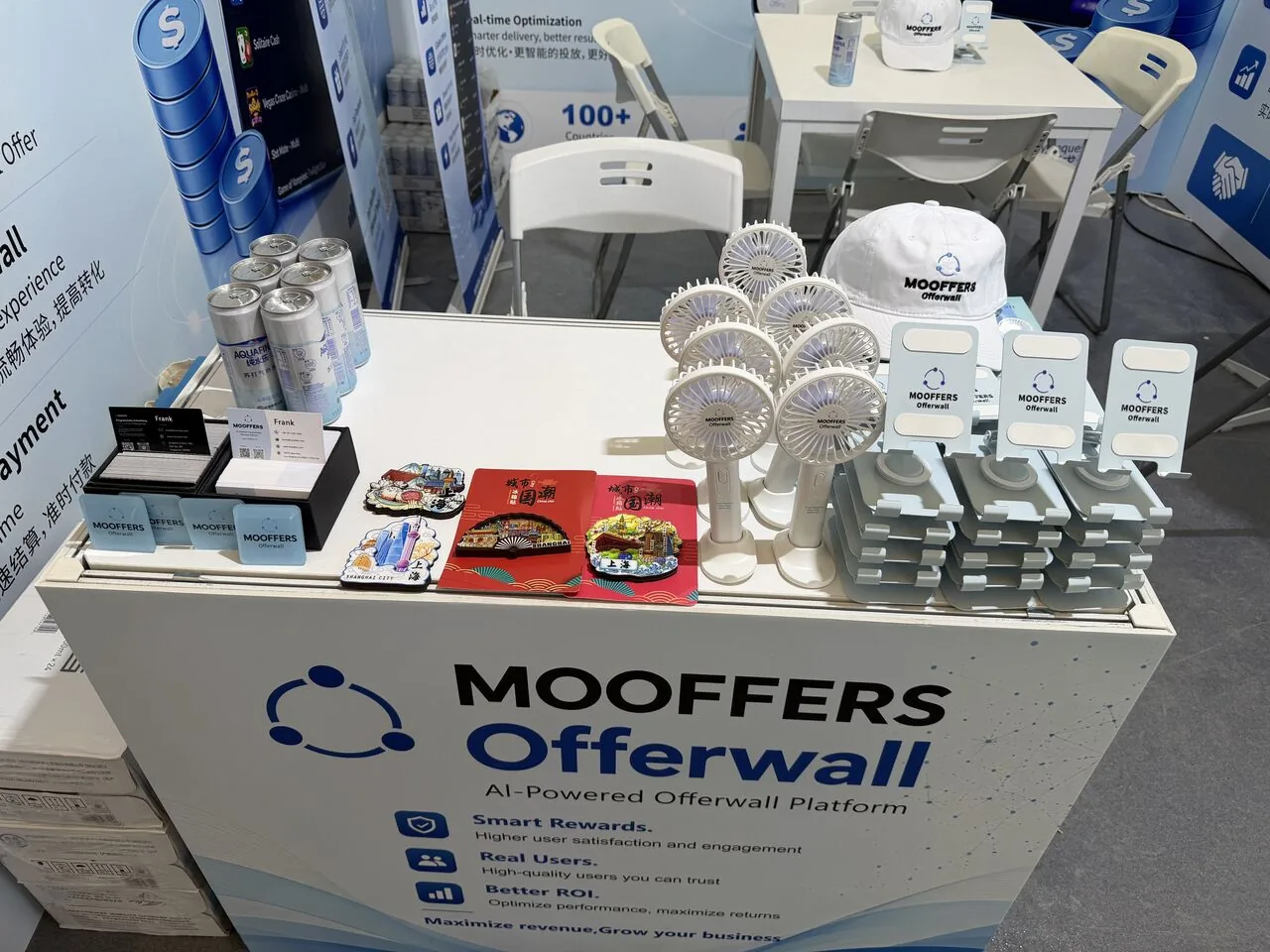 Mooffers booth counter with branded caps, fans and gifts at the Shanghai expo